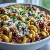 A hearty bowl of One-Pan High Protein Chili Mac, featuring smoky spices, beans, and melted cheese, perfect for a weeknight dinner.
