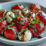 A refreshing Fresh Strawberry Caprese Salad with balsamic glaze, ready for summer enjoyment.