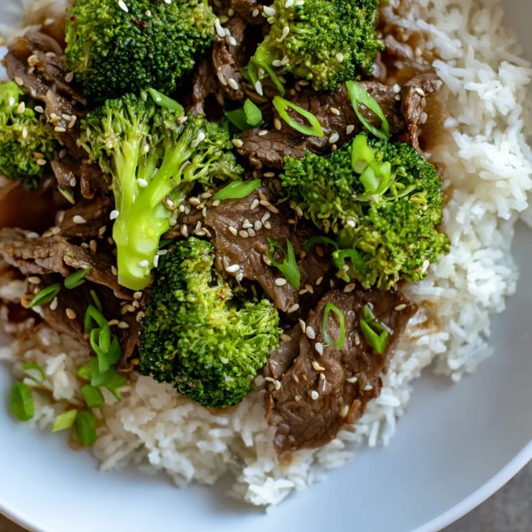 This delicious Beef and Broccoli stir-fry showcases perfectly cooked beef with vibrant vegetables and rice.
