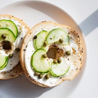 A toasted bagel with cream cheese, perfectly golden, ready for a delicious breakfast.
